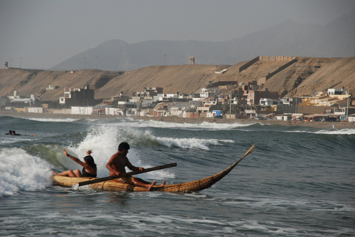 Wave riding in a traditional Peruvian reed boatThis Totora reed fishing boat is being ridden at Huan