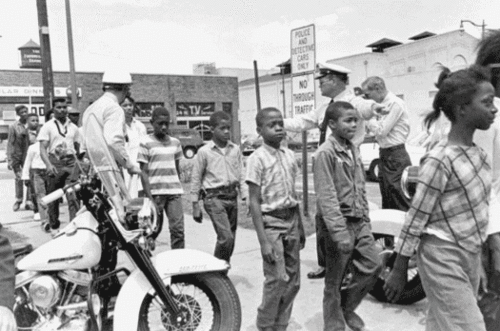 choice36c:  Police lead a group of African-American school children off to jail following