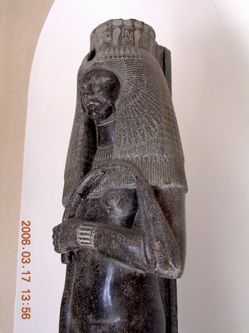 Statue of Queen Tuya, wife of Seti I, mother of Ramesses II. On the side below her leg is a relief o