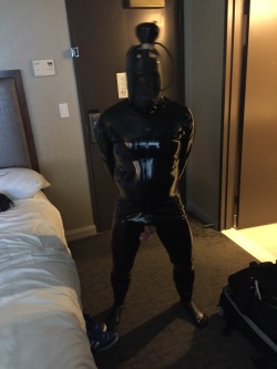 rbrlover:  One of my roommates at #IML2016 made the “mistake” of mentioning he had bought a piss hood and rubber suit and that he hadn’t tried them yet. Soon enough he found himself fully sealed in rubber head to toe, cock and balls bound to his