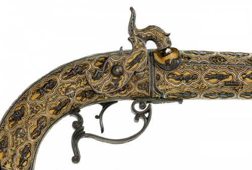 A pair of Spanish percussion pistols, chiseled and gold damascened, crafted by Eusebio Zuloaga, mid 