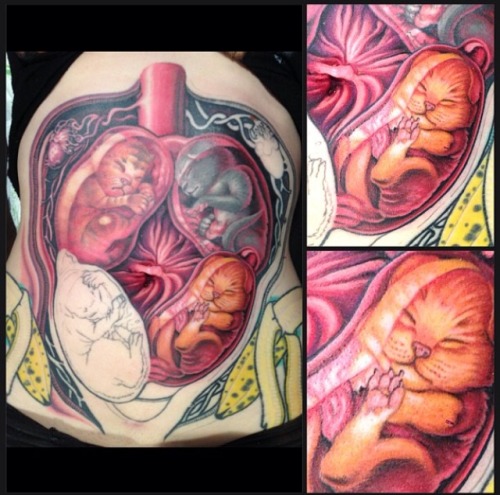 red-hellion:  falsemrsa:  valcordesamoe:  red-hellion:  Cat womb stomach tattoo by Tim Kern of Tribu
