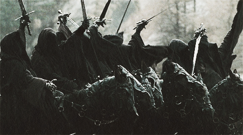 jorrah:  They were once Men. Great Kings of Men. Then Sauron the Deciever gave them Nine Rings of Power. Blinded by their greed, they took them without question, one by one, falling into darkness. And now they are slaves to his will. They are the Nazgûl,