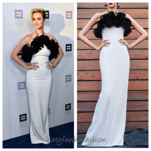 Katy is wearing a Rasario SS17 ruffle halter gown, Manolo Blahnik heels, Anita Ko rings and a Ana Kh