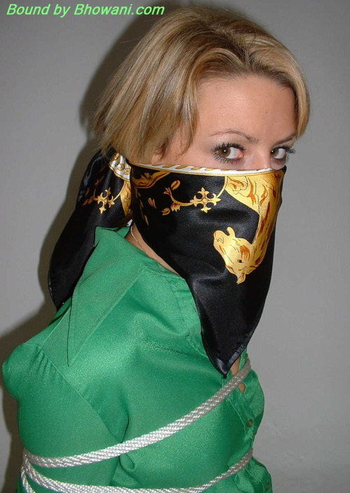 graybandanna:  Sabrina tied up in a green blouse with both a scarf cleave gag and a scarf over the nose gag