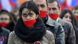 willflyforbeer:  People wearing gags gather in central Moscow on April 24, 2015 to mark the 100th anniversary of the Armenian genocide.Photo by Dmitry Serebryakov / AFP / Getty Images