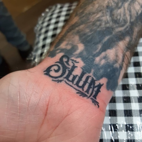 Added the #slum of the #yelawolf #slumerican #lable to this fella’s wrist. #lettering #wristta