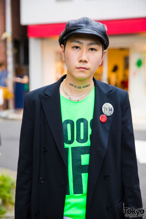 Kyohei on the street in Harajuku wearing a vintage blazer with leather shorts, a leather newsboy hat