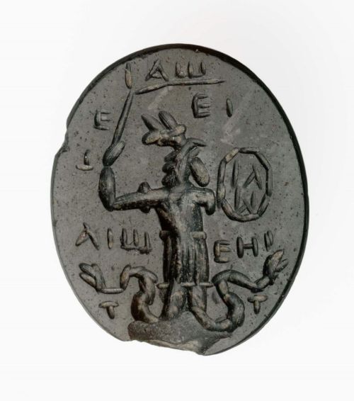 likeavirgil:Oval gem with rooster-headed, snake-legged deity in armor, holding a whipRoman, Imperial