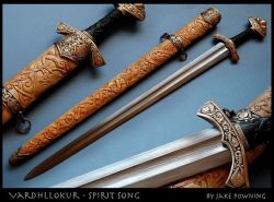 art-of-swords:  Handmade Swords - Wardhllokur (Spirit Song) Maker &amp; Copyright: Jake Powning Measurements: overall length 86.4 cm; weight: 1,275 kg A pattern-welded Viking sword made in 2009. It feature a bog-oak grip while the scabbard if yellow