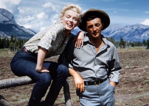 thecinamonroe: Marilyn Monroe and Robert Mitchum on the set of “River of No Return” (1954). Photo by