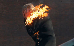  An anti-government protester is engulfed in flames during clashes with riot police outside Ukraine’s parliament in Kiev, Ukraine, Tuesday, Feb. 18, 2014. 