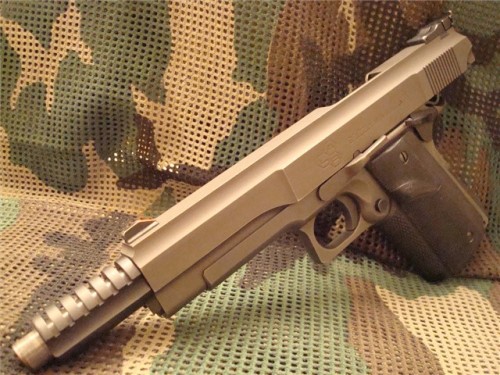 just-remington:  la-volpe-bianca:   gunrunnerhell:  LAR Grizzly Longslide Very rare variant of the Grizzly, there were several longslide length options. The Grizzly is an oversized version of the 1911 and uses magnum caliber cartridges normally designed