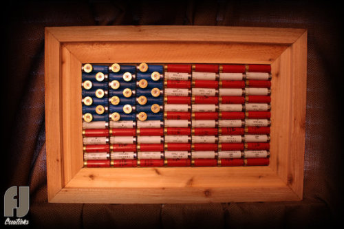 gunrunnerhell:  Shotgun Shell FlagCustom made to order decorative American flag made of red, white and blue shotgun shells by FJ Creations. I’m not 100% sure they still make these but you can contact them in the link below to check. (GRH)Source