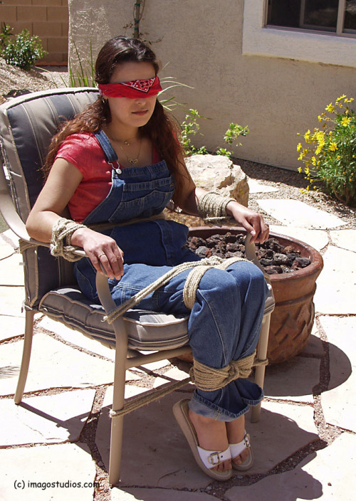 nowheretohide14:  graybandanna:  If you have to be bound, gagged and blindfolded, sitting out on the patio in the sun is a lot nicer than a cold, dark dungeon  I love this. More outdoor photos. 