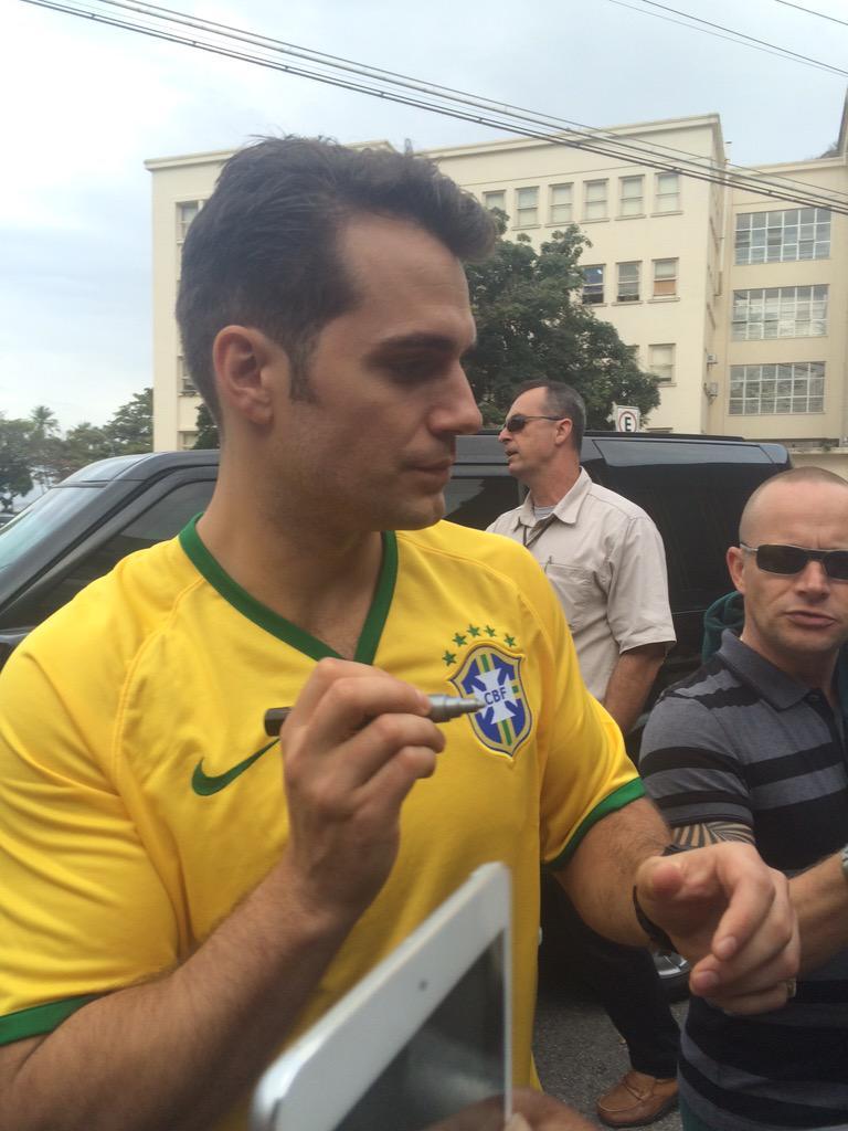 cavillheugh:  Henry Cavill signing autographs in Rio and wearing the football (soccer)