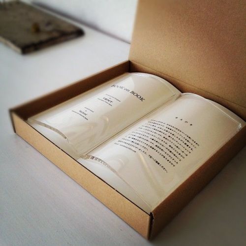 teamshercock:utilitarianthings:&lsquo;Book on Book' is a transparent paperweight that holds