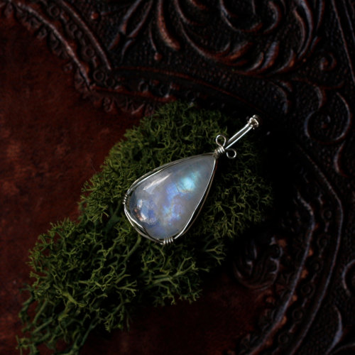 this beautiful wire wrapped rainbow moonstone pendant is available at my etsy shop.use the coupon co