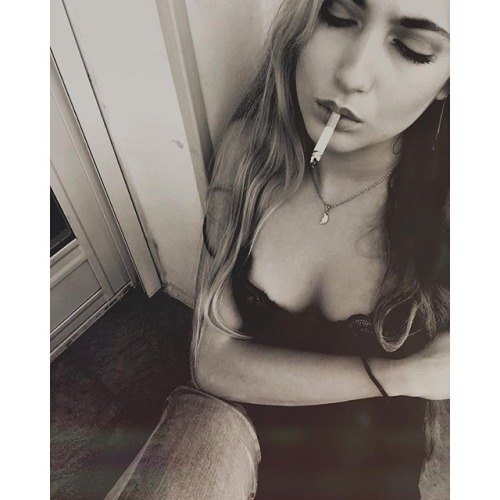 christopher-l-morris:Dangling her cigarette, eyes closed, loving the nicotine