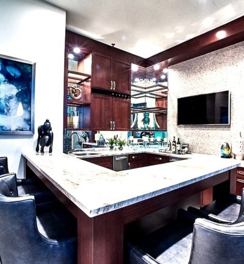 Contemporary Home Bar - Home BarA Mid-sized Trendy Home Bar Design Example With A Seated U-shaped Beige