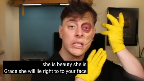 A screenshot of Janus from the Sanders Sides video Janus' very inspiring GRWM makeup tutorial, with the subtitles, "she is beauty she is Grace she will lie right to your face".