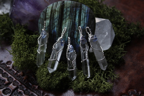 these beautiful clear quartz point pendants with tanzanite aura quartz beads are available at my ets