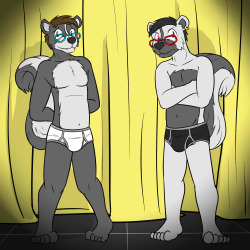 Two skunk dudes having to stand on a stage in their undies.