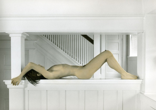 Nude on white ledge by Michael Gesinger