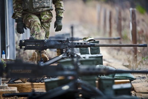 militaryarmament: Trainees firing the Browning M2 from the seated, tripod mounted position as instru