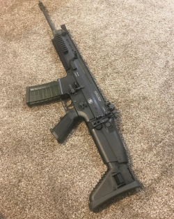 tacticalsquad:    tropicgungirl SCAR 16 in Black with an HK MR556 mag. 