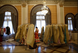 New York Times Pictures of the Day:  France and Elsewhere A model changed out of a dress by Luisa Pérez &amp; Luisa Riu backstage during a flamenco fashion show in Seville, Spain.  foto credit:  Marcelo Del Pozo/Reuters 