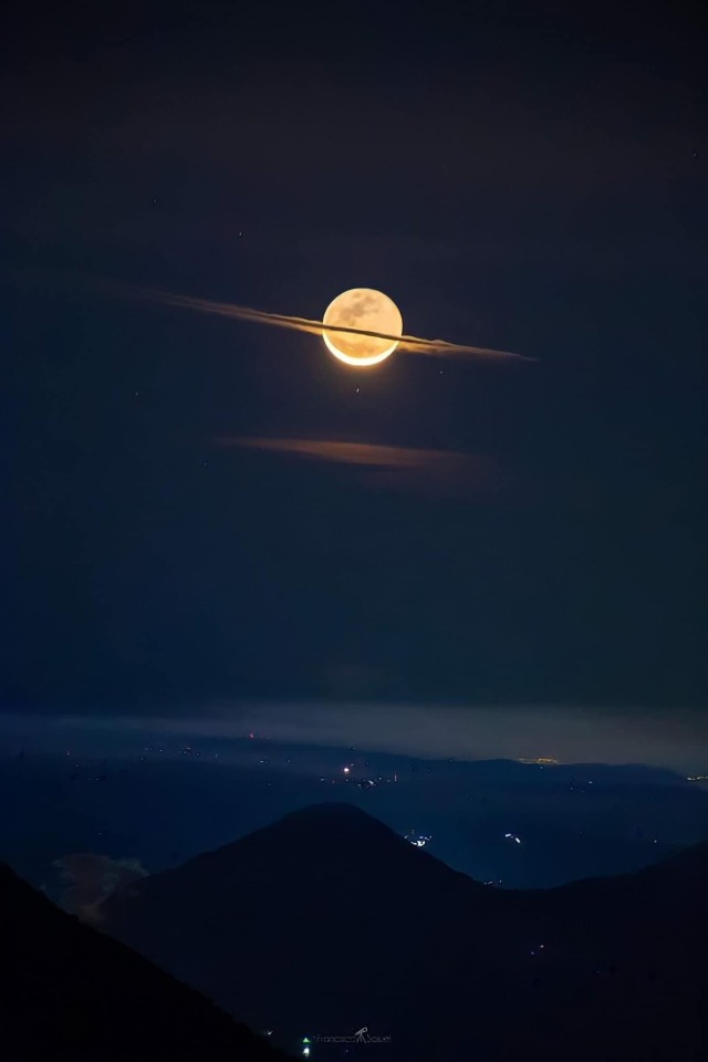 raspberry-flower:adelphicoracle:without-ado:Moon dressed like Saturn ll Francisco Sojuel l Guatemala She’s cosplaying[ID: two photos of the moon in the night sky. the clouds make it seem as if the moon has rings /end ID]