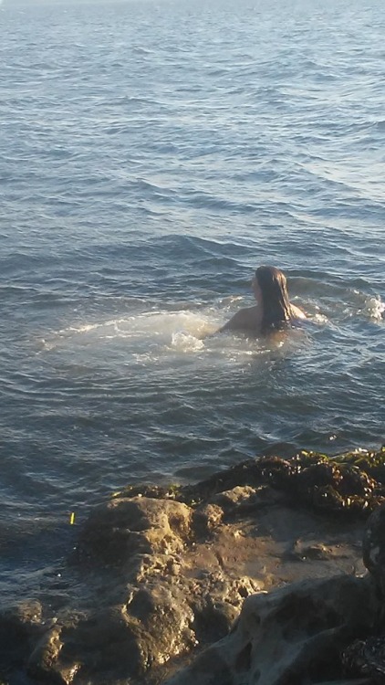 My spellbinding sea goddess takes a dip in the cool waters of the ocean at the beach last year