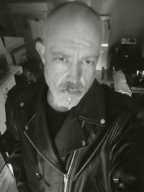 Smoking in leather biker jacket