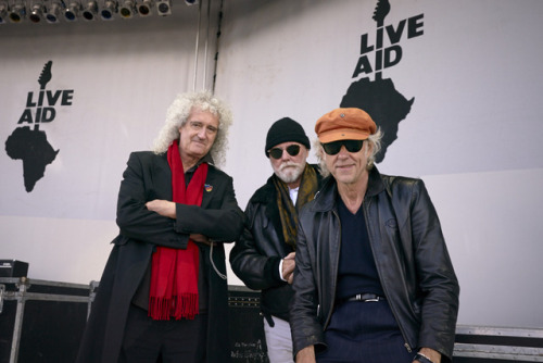 official-pete:Brian May, Roger Taylor, and Bob Geldof at the live aid movie set
