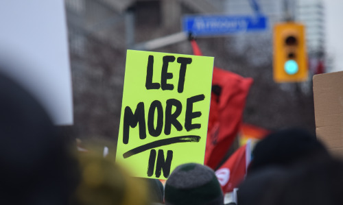 Signs from the National Day of Action against Islamophobia and White Supremacy in Toronto. Lots of c