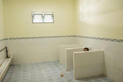 chhoraa:  Indoor plumbing in newer schools has helped whittle Vietnam’s open-defecation rate from 39 percent in 1990 to almost zero today. Even young students, like this five-year-old in Ben Tre city, act as sanitation ambassadors, bringing home lessons