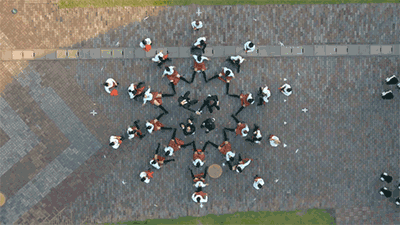digg:  OK Go is up to their old tricks again.  btw all those colored dots are people