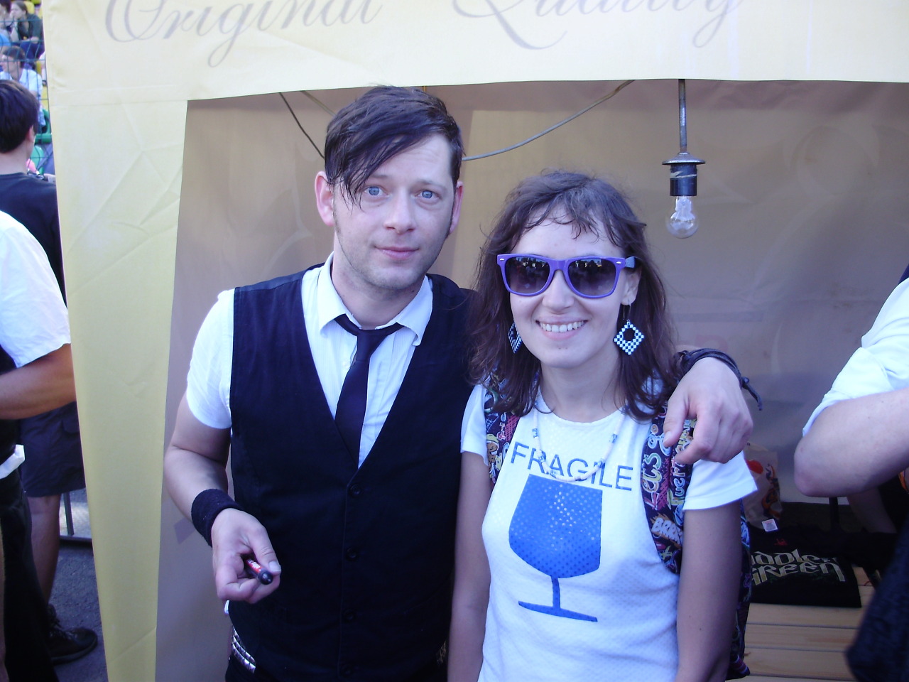 cloverswine:  Me with the Fiddler’s Green vocalist, and their drummer’s autograph.
