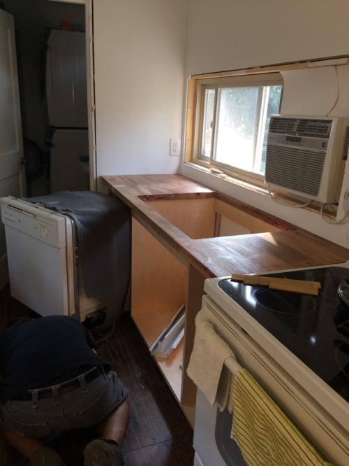 Getting the dishwasher and kitchen sink installed!! #containerhouse #shippingcontainer