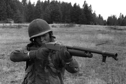 they-drift-like-worried-fire:  Fort Lewis, Washington, January 1982  Pfc. Art Burgess, a candidate in the Ranger Indoctrination Program (RIP), 2nd Battalion, 75th Infantry (Ranger), fires a Winchester-built combat shotgun during special weapons training