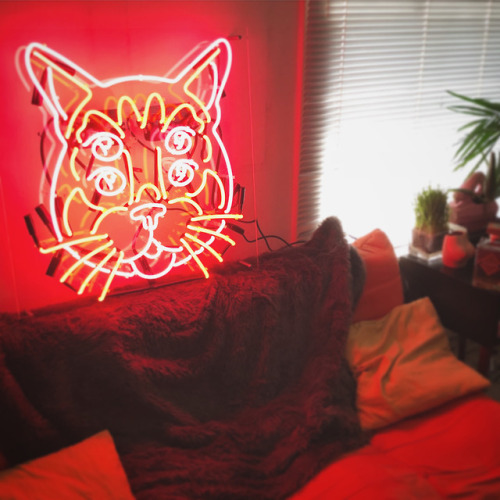 Custom neon 4 eyed cat created for the opening of the bourbon breath show at KO Studio Gallery with 