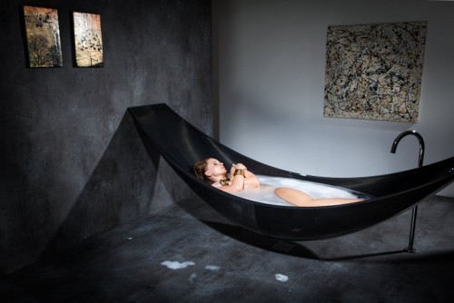 carlosison:  everything-creative:  This is a great idea!! The Vessel bathtub is made out of carbon-fiber and is hanging like a hammock. It is designed by Splinter works.  I WANT THIS!   