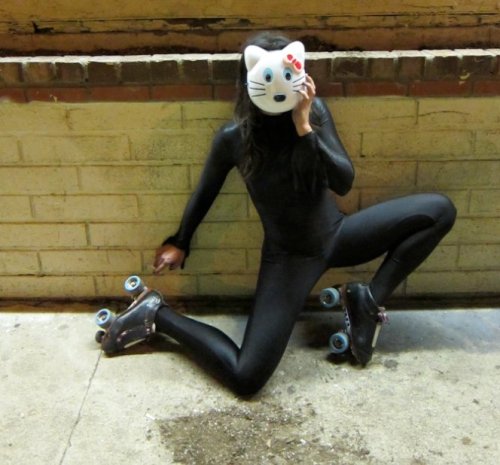 Beautiful black spandex cat with roller-skates. 