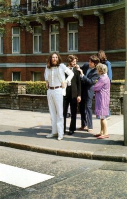 The Beatles prepare to cross Abbey Road 44