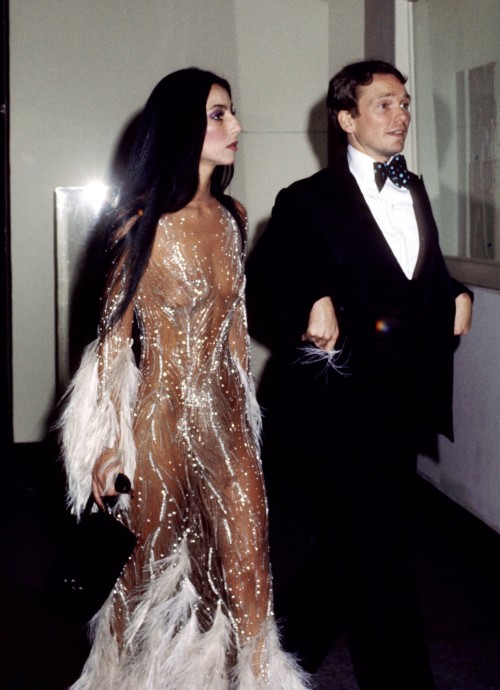 ohyeahpop: Cher in Bob Mackie feathered dress and Bob Mackie in the 1970s. Ph. Ron Galella