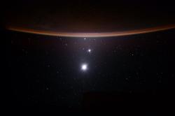 spacebloggers: Astronaut Scott Kelly captures a Earth/Moon/Venus/Jupiter alignment from the ISS  