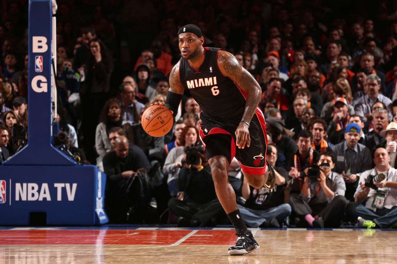 nba:  LeBron James of the Miami Heat moves the ball up-court against the New York