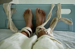 paintdeath: File photo of a patient at a psychiatric hospital in Fuzhou receiving a blood transfusion with bound feet. 