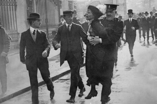 Women’s suffrage activist Emmeline Pankhurst is carried off by a police officer outside of Buc